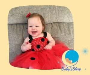 Happy baby in Ladybug dress